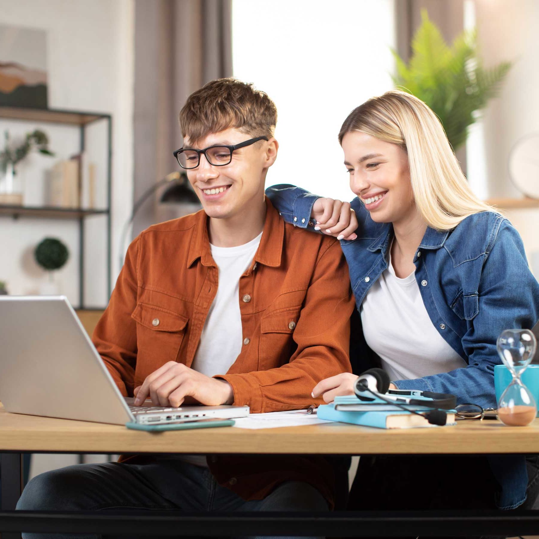 smiling caucasian man and woman using laptop at cr 2022 04 28 01 30 01 utc e1652151320715
